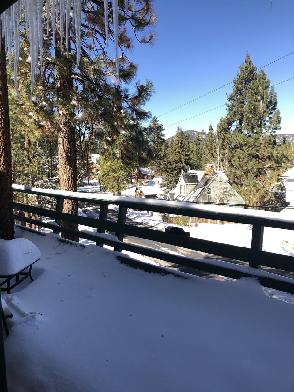 The front balcony at the 2nd floor is covered with snow.
