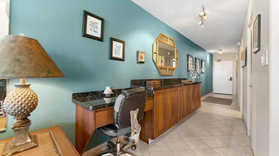 Entry hall with large built in maple/granite buffet and functional desk area.