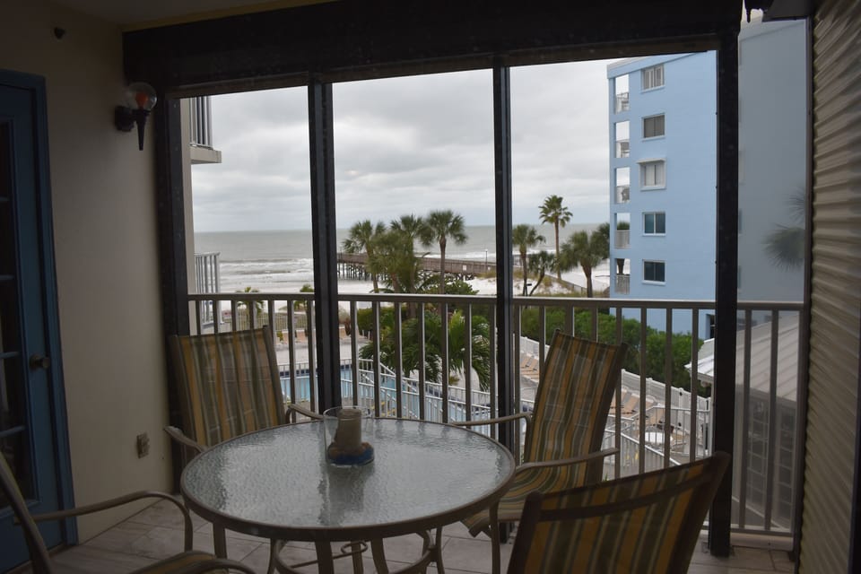 Balcony overlooking pool and gulf
