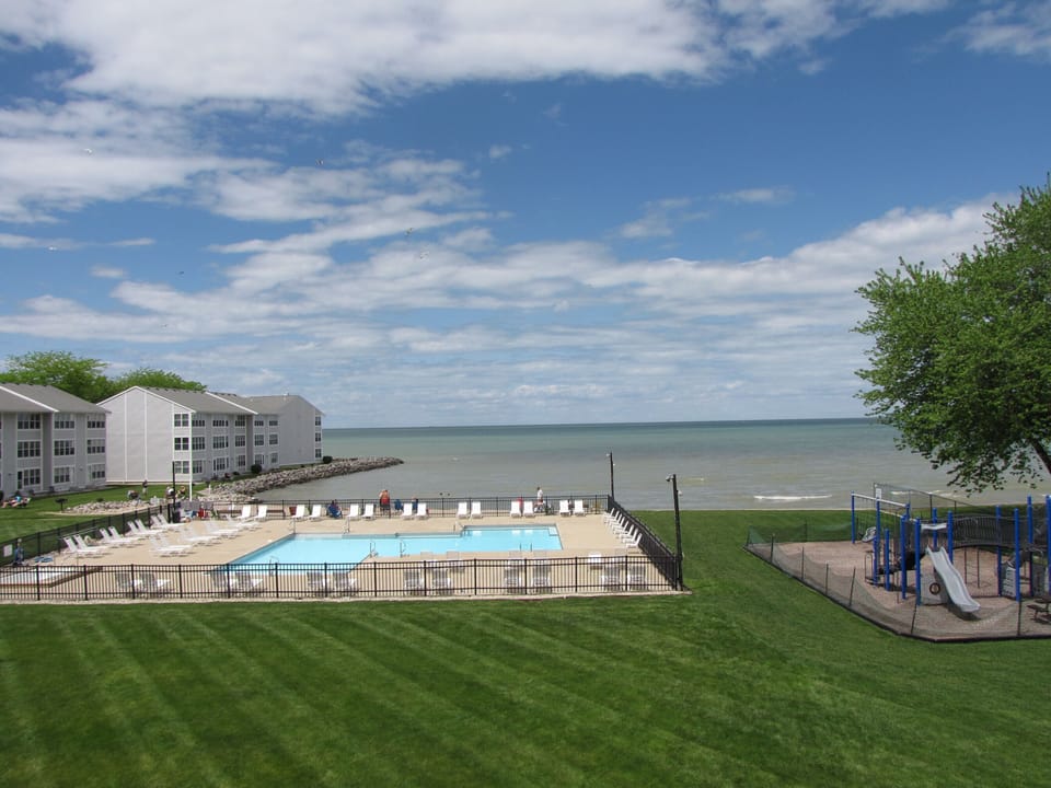 View from the condo. Steps to the lawn, pool, beach, and playground.