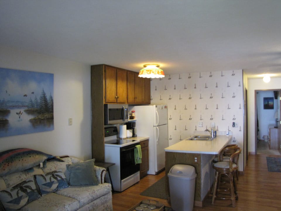 Kitchen comes fully stocked with cookware. Counter is great for casual dining.