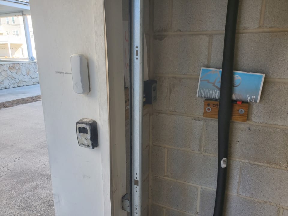 Garage door opener keypad Grey Color on the top.