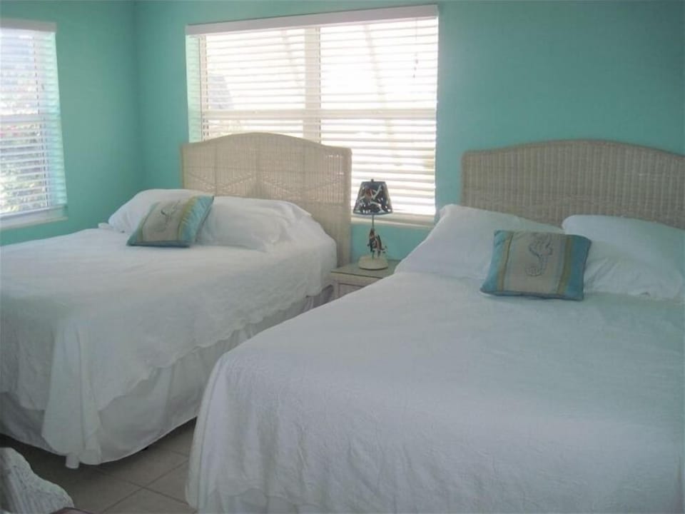 2nd bedroom with two comfy queen beds. There is also a tv in this bedroom.