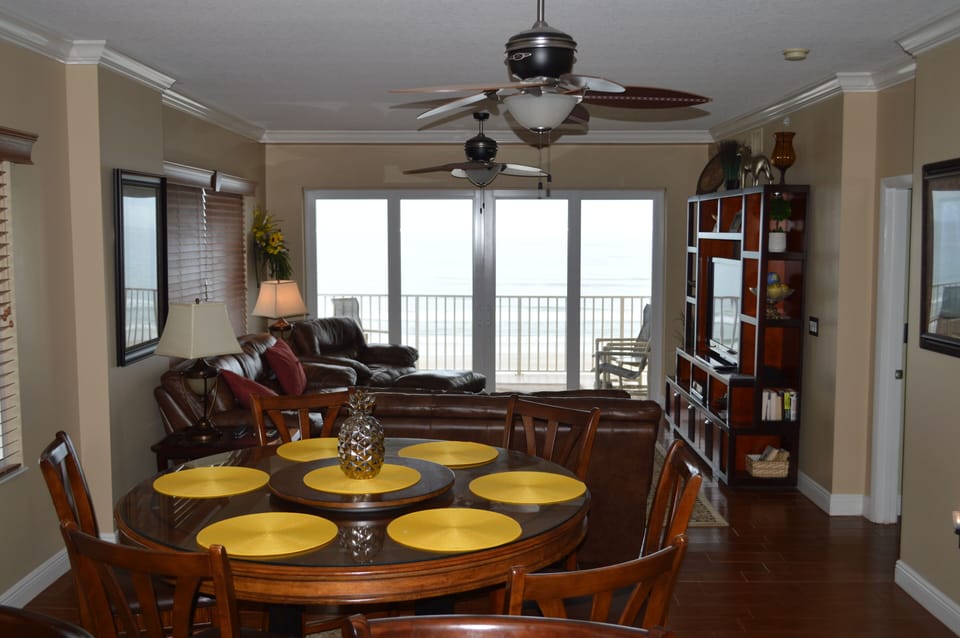 Dining table and chairs seat up to six people; eat in bar allows for another two