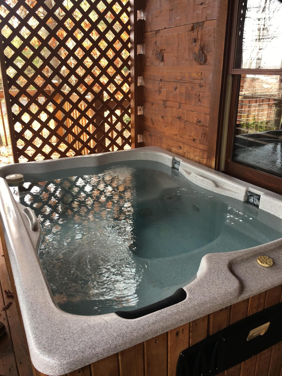 4 person hot tub located on the front porch overlooking Pigeon Forge, 