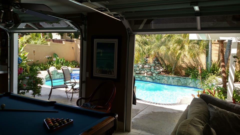 View from family room. Notice the spacious feel the roll up doors provide