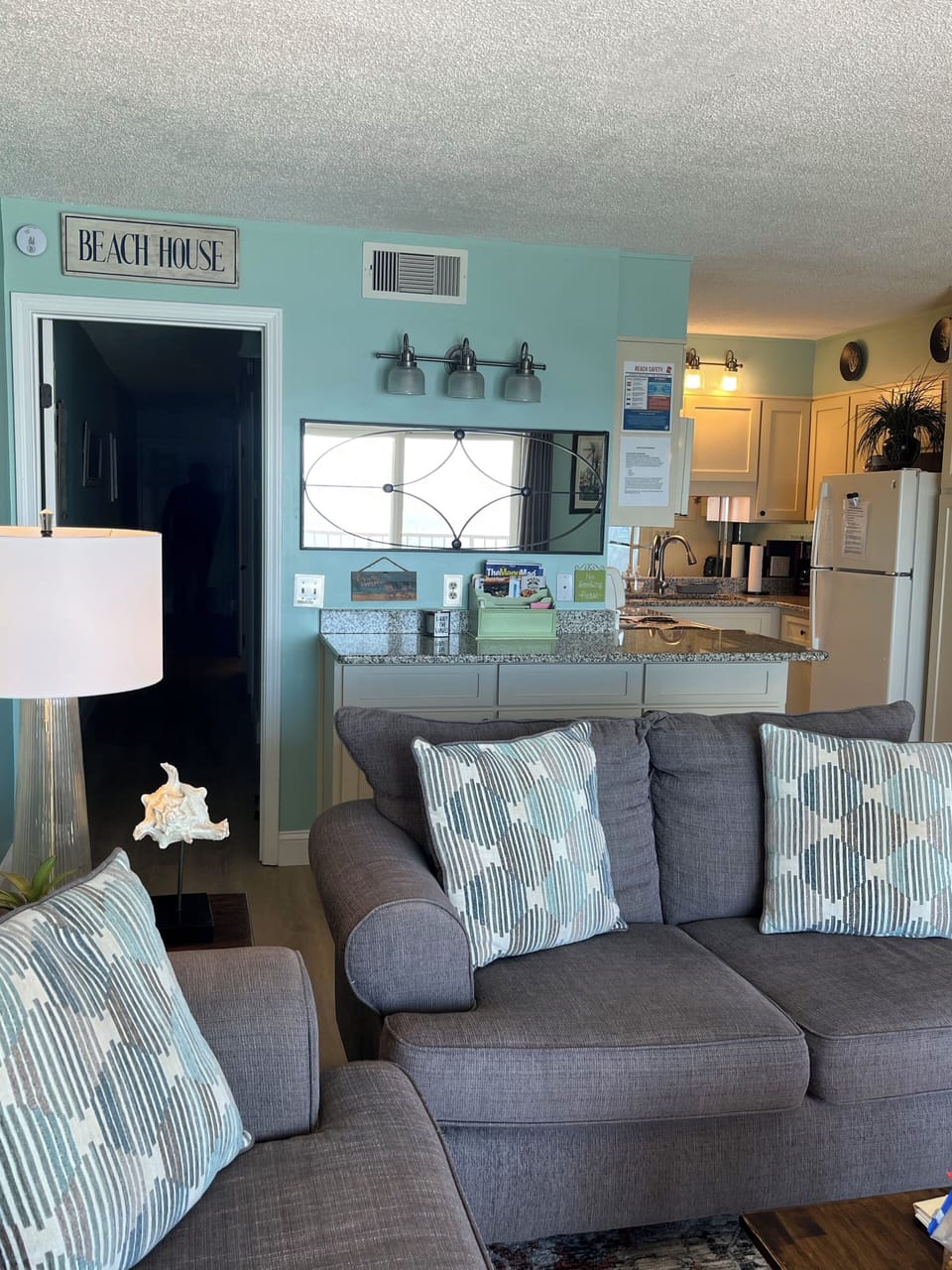 Quick view behind sofa/loveseat down hallway from family/living area 