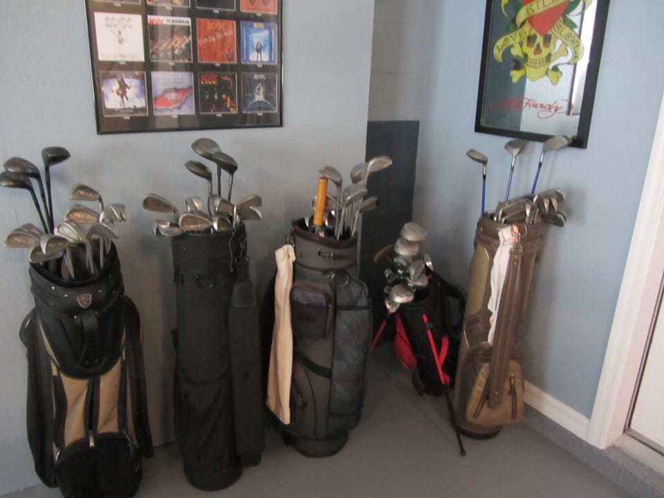 Game room has 7 sets of golf clubs for your use. 