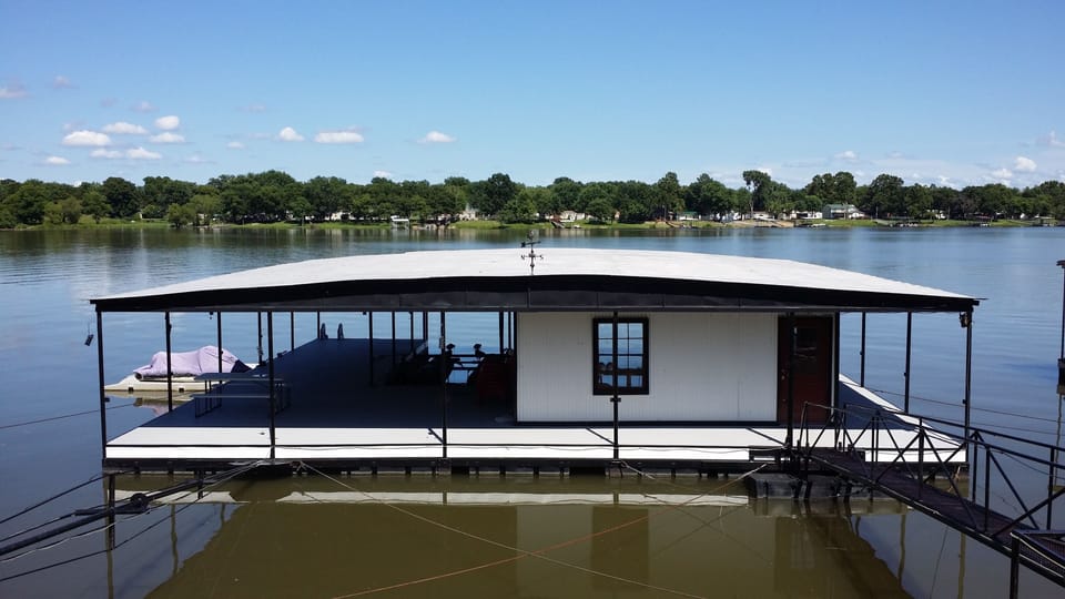 Private dock with 2 boat slips and 2 personal watercraft slips.