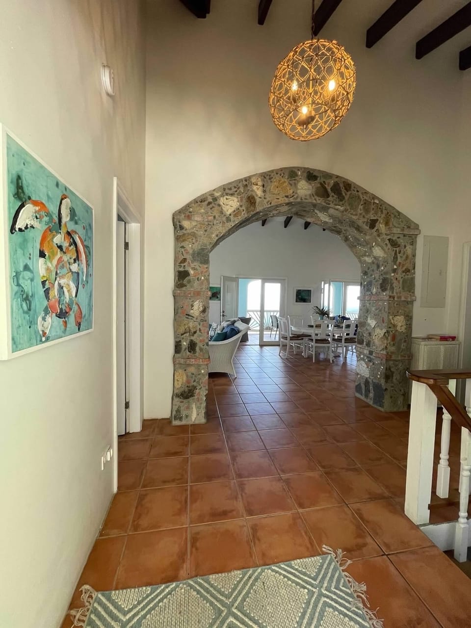 An airy foyer welcomes you! A full bath and bunk room are also on this level.