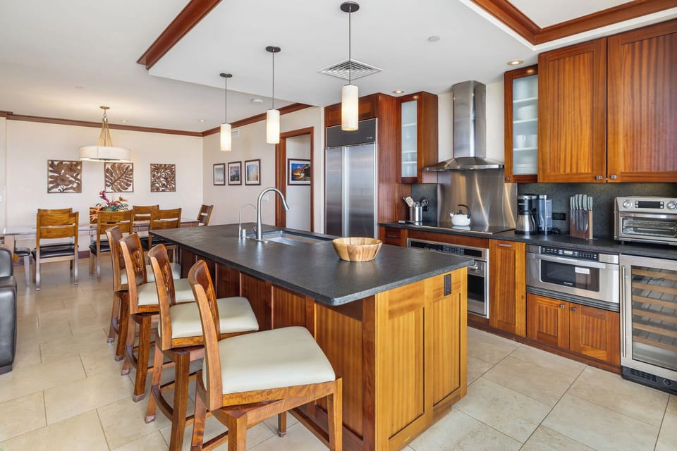 Large kitchen island and barstools where guests can gather