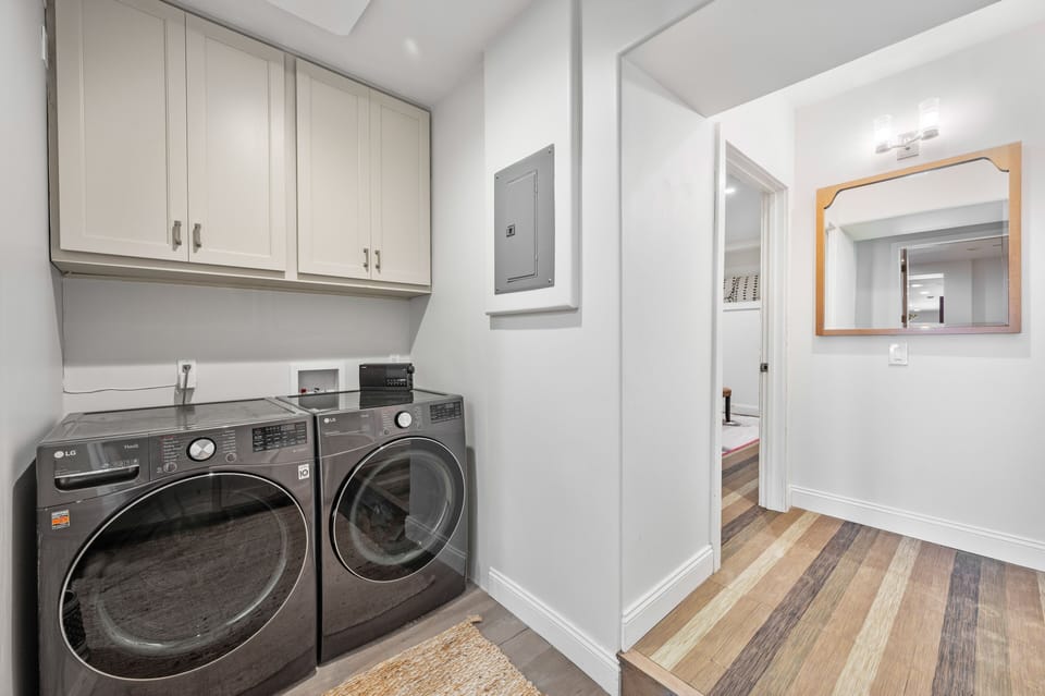 Washer and dryer & storage space. 