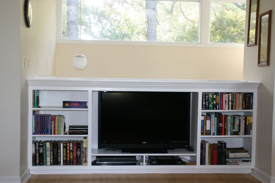 Widescreen TV in bookcase-overlooking stairway-
