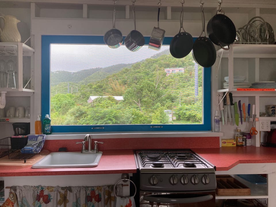 While washing the dishes, scan the the surrounding hills from the 