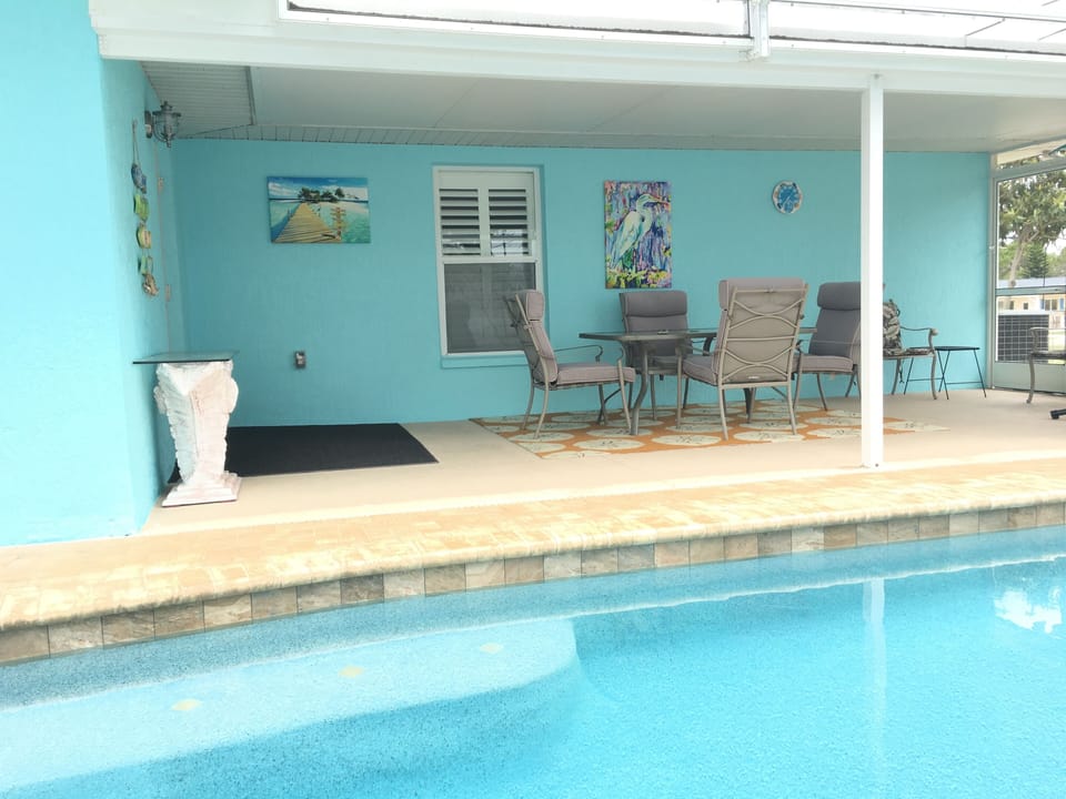 Dine poolside rain or shine! Optional pool fence  to create a child-safe area. 