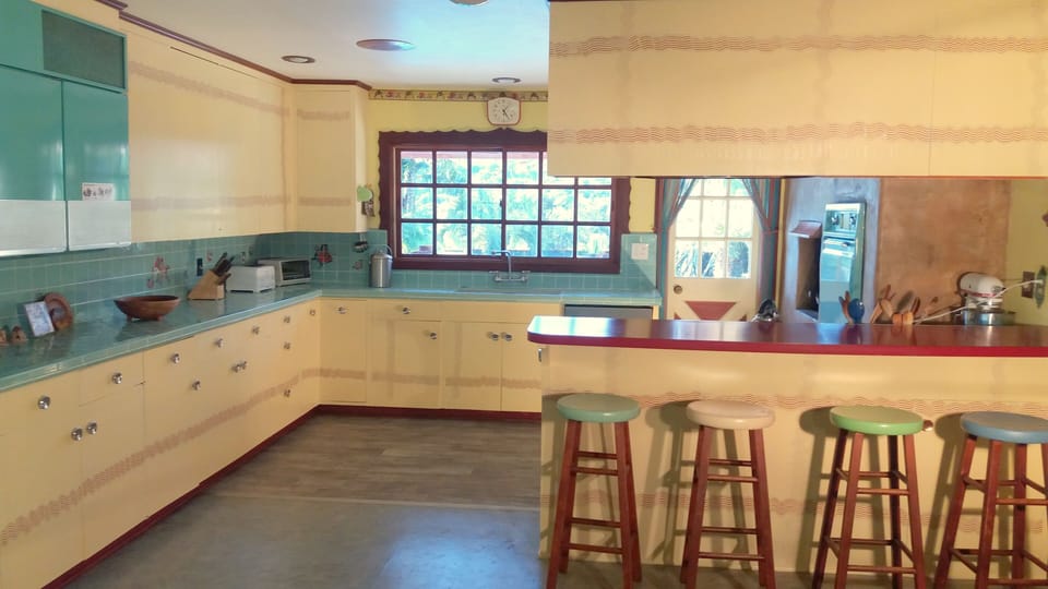 Large , 24'x 15' family kitchen with poolside table outside. Counter seats 4.