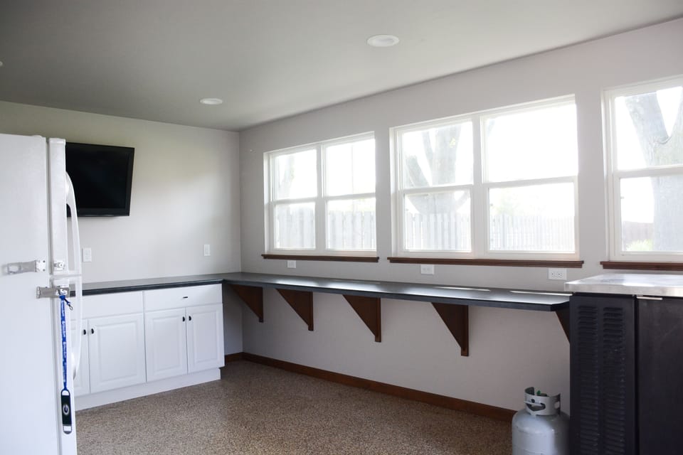 Pack Shack 1 sunroom off of garage and connects to back patio! 