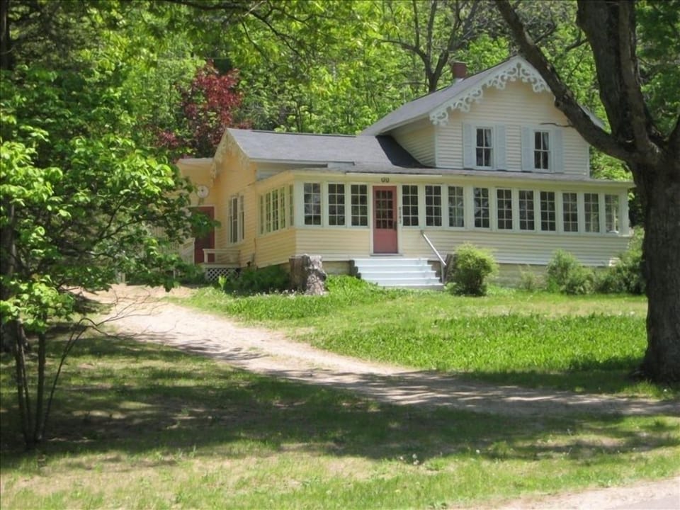 Circular pull through driveway, an acre of land, across the road from Glen Lake