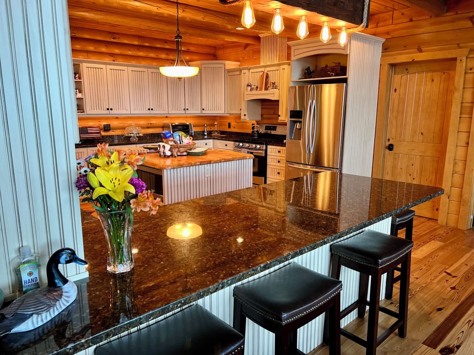 GORGEOUS KITCHEN- granite, island w/beverage fridge & peninsula w/seating for 8