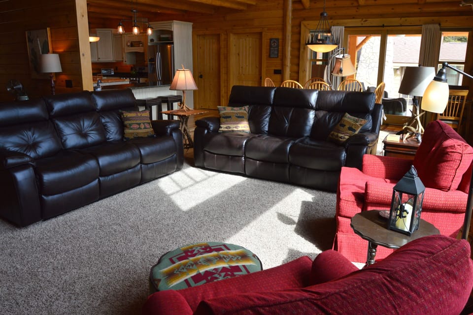 Twin full sized sofas w/4 reclining seats & 2 comfy chairs w/ottomans 