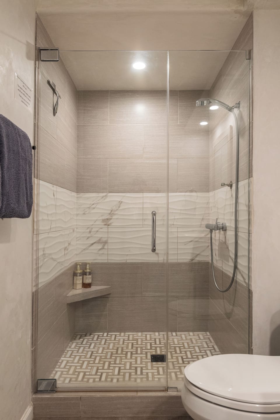 Private full bathroom with fresh towels and body wash.