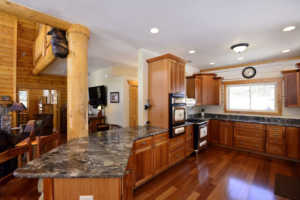 The heart of the home kitchen w/ bar seating is open to the great & dining rooms