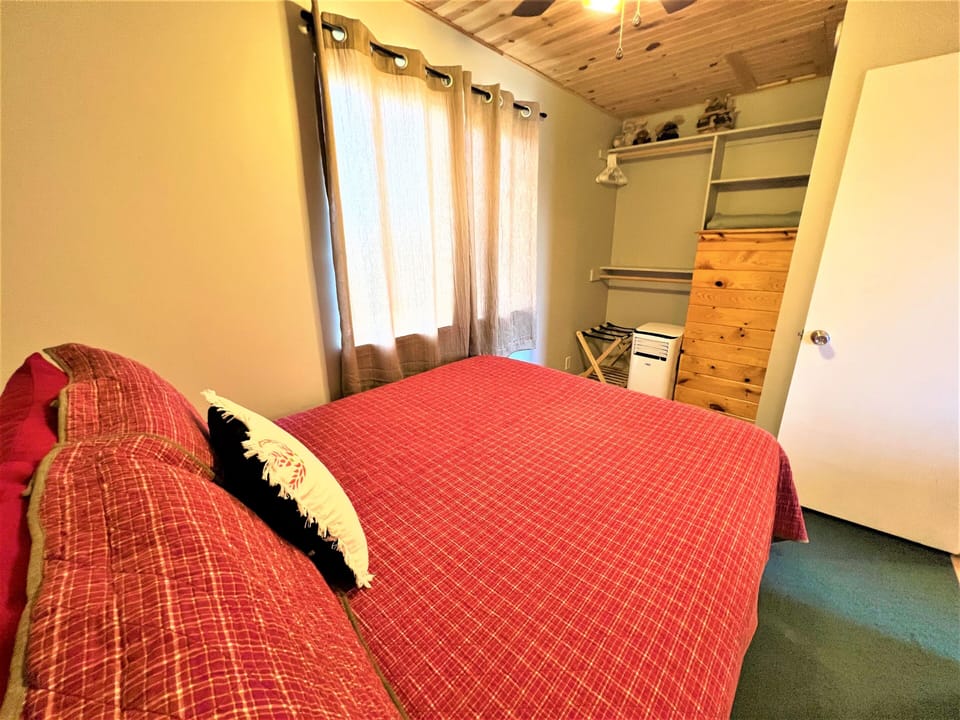 Queen bedroom with AC unit