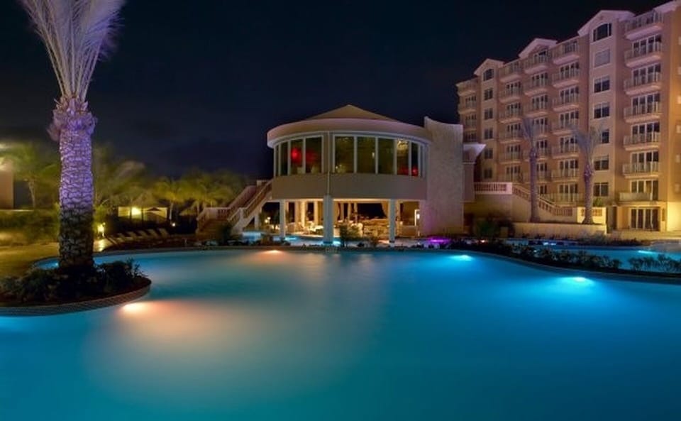 View from ground level walking to the pools, dining area and beach.  