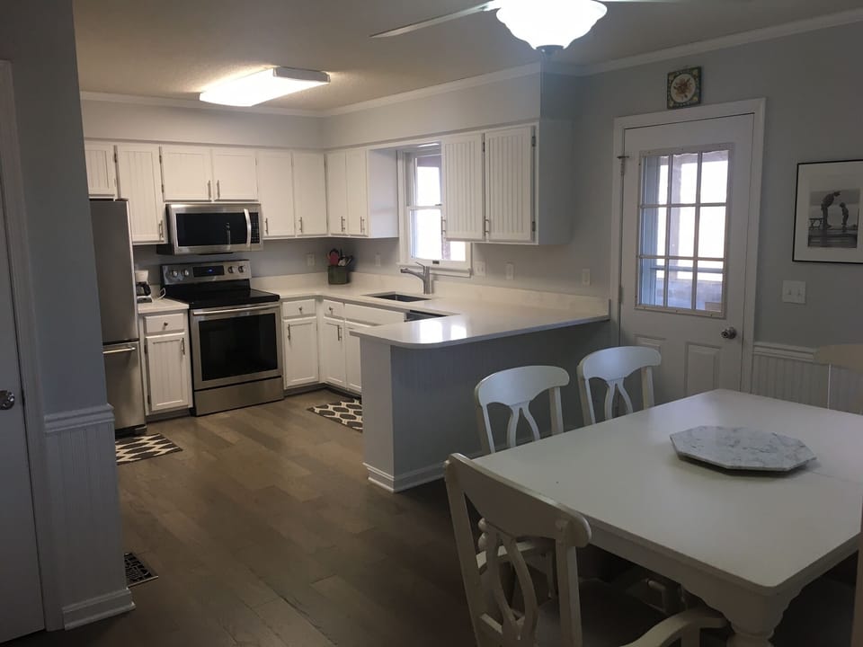 Kitchen with eating area.  Comes with leaf to expand table.