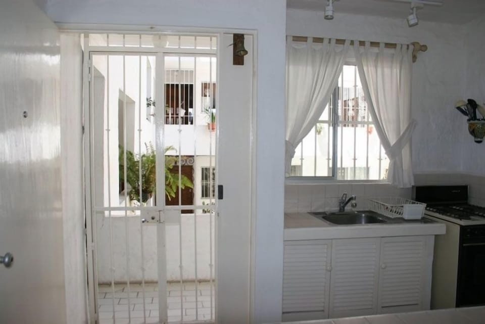 Front door and kitchen