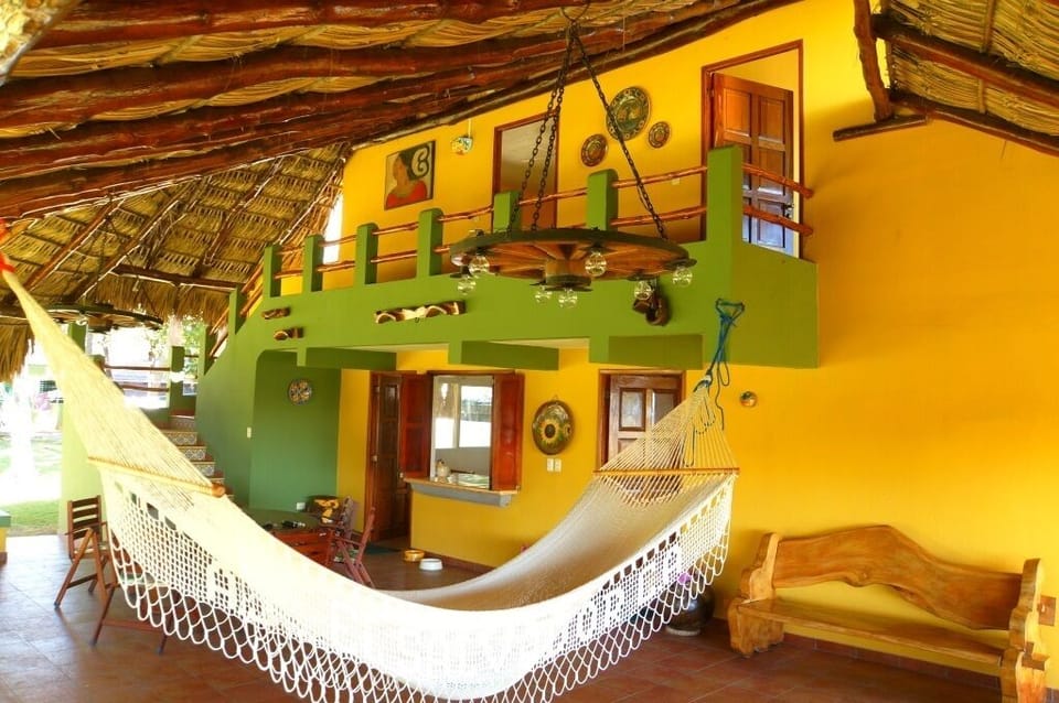 view of the social area, 2 bedrooms upstairs. Hammocks to take that deserved nap