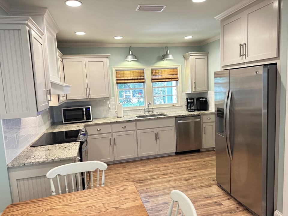 Kitchen has single basin sink. Furnished with both drip and Keurig coffeemaker.