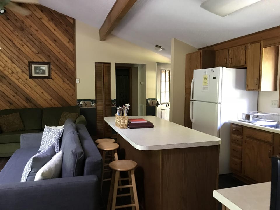 A galley kitchen is stocked with cooking and baking supplies