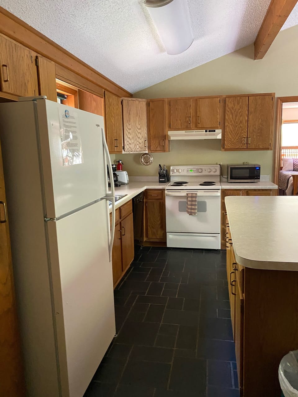 Kitchen has a dishwasher and is well equipped to cook
