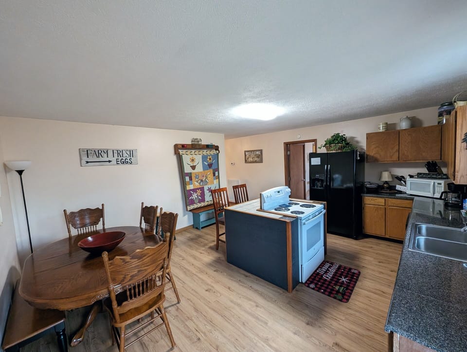 Kitchen with ice/water dispenser, coffee station, dishwasher, seating for 8.
