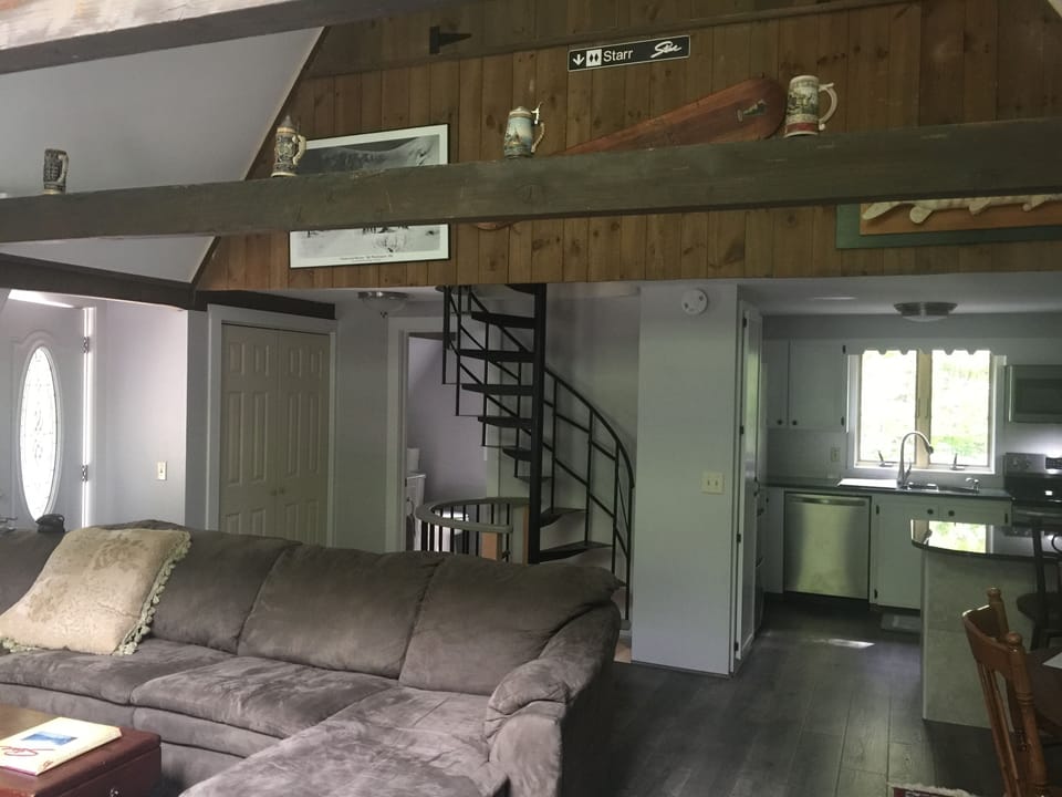 Living room, kitchen , spiral stairs view 
