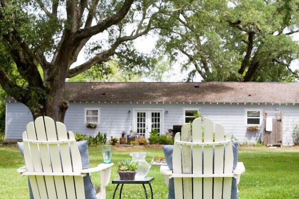 Oak trees provide lush canopy in large backyard