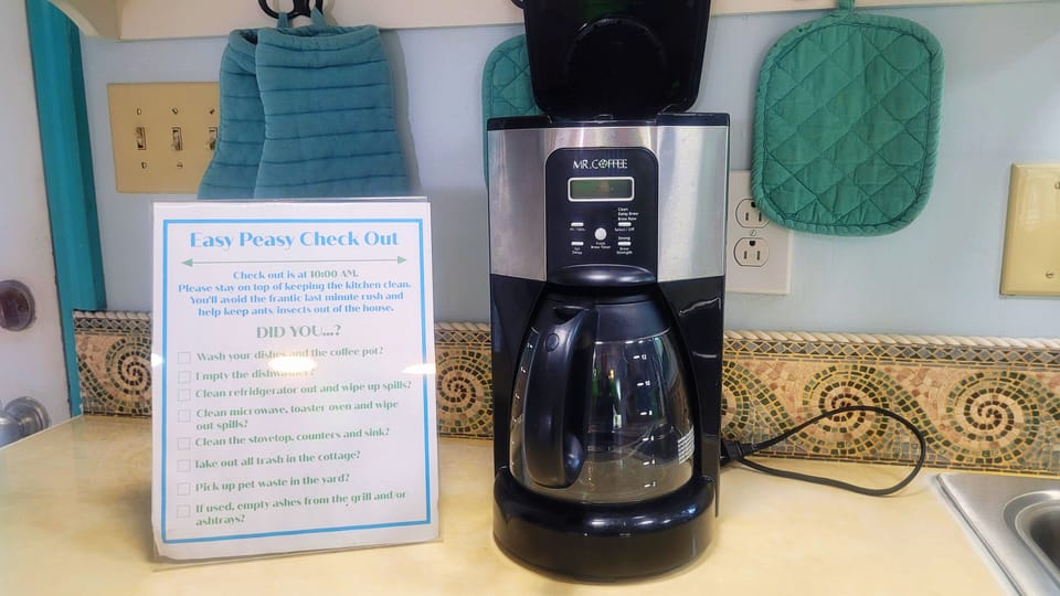Traditional drip coffee maker with basket filter. 
