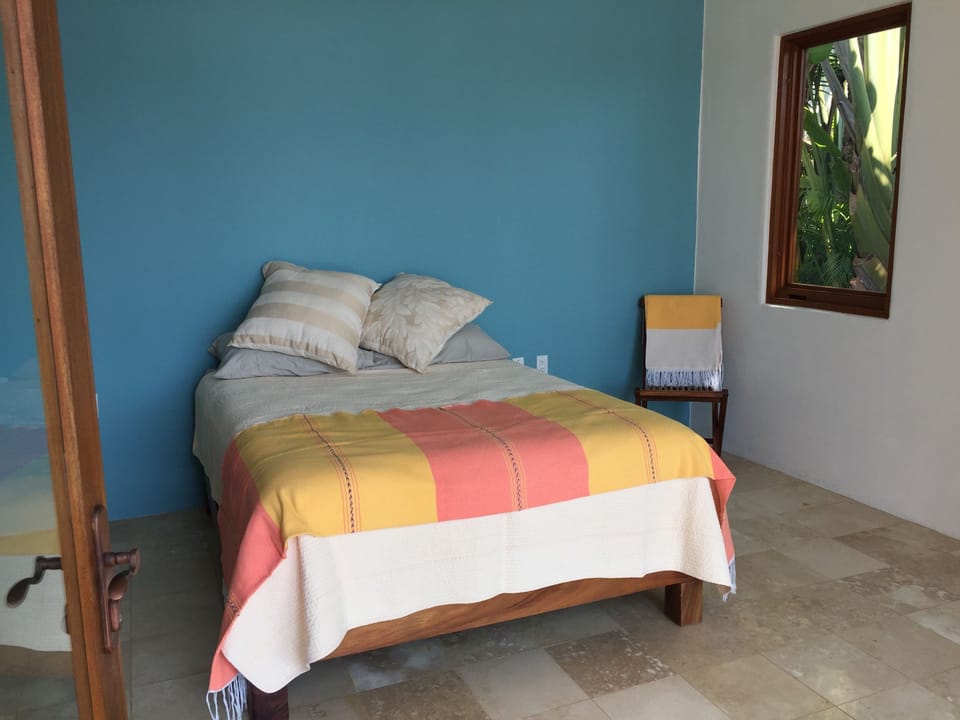 Second master suite, also opens to ocean views & veranda