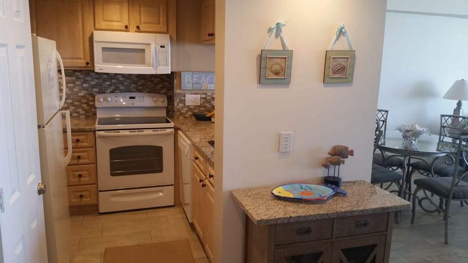 New updated Kitchen with Granite and Custom Tile.