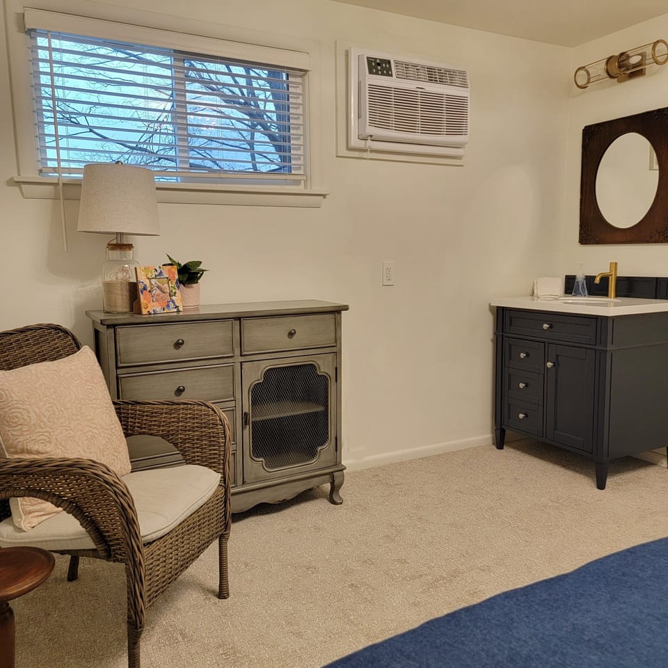 and its own vanity sink with sitting area.