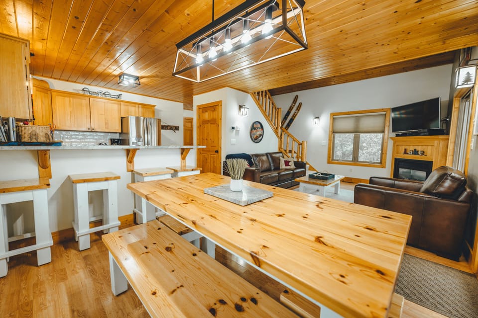 Large family style table open to kitchen