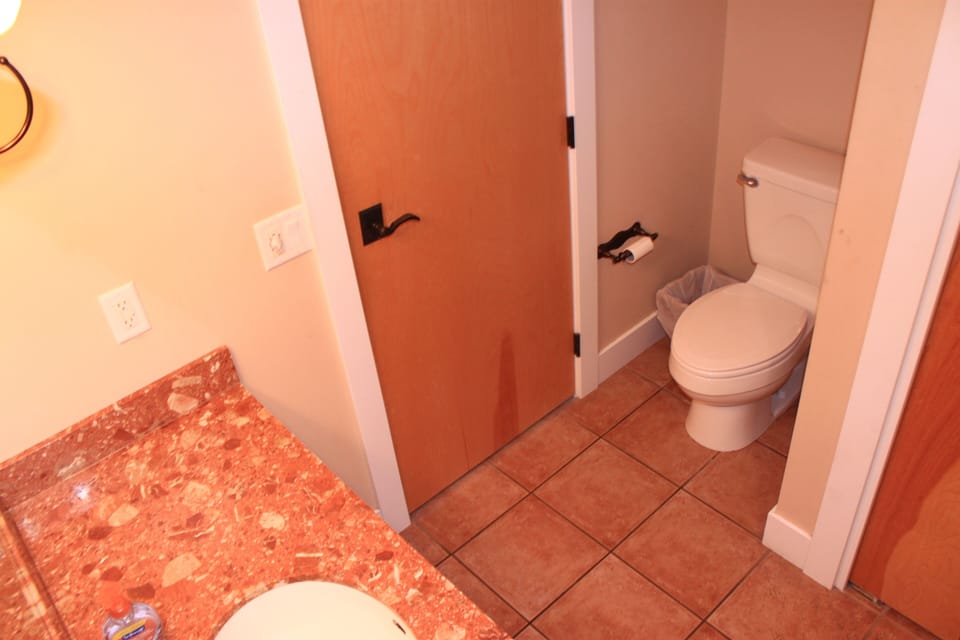 Bathroom with Hairdryer and bath tub shower