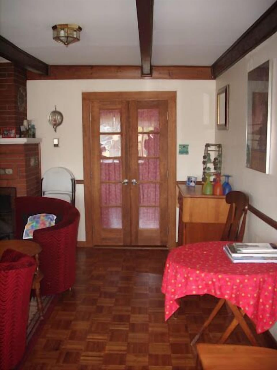Going from the dining area towards the yellow downstairs queen bedroom.