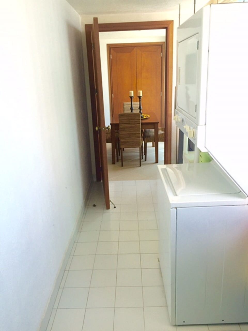 Laundry room next to kitchen, hallway to bedroom #4