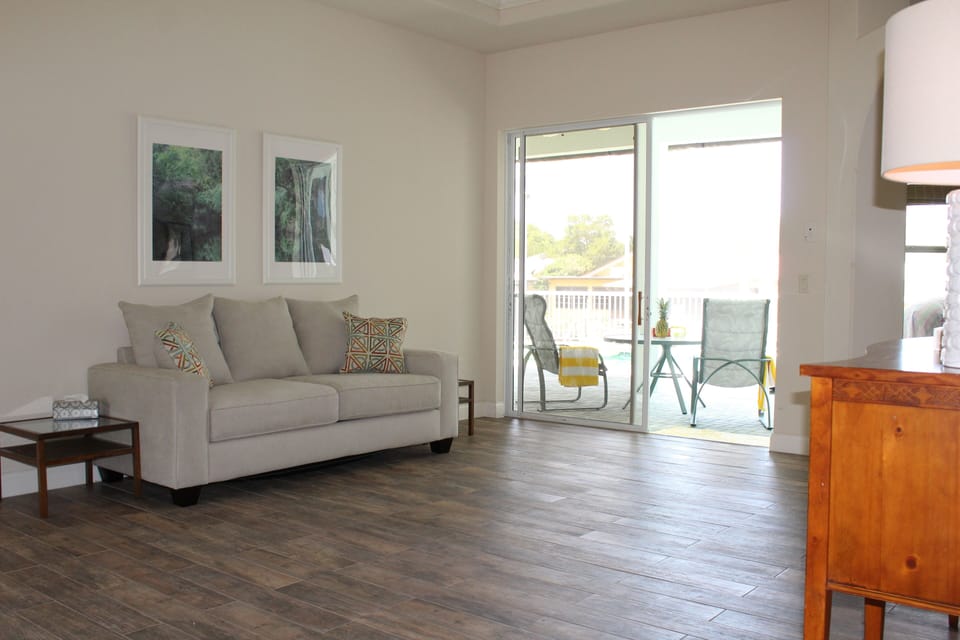 View from the living room out to the pool.  Queen size sleeper sofa.