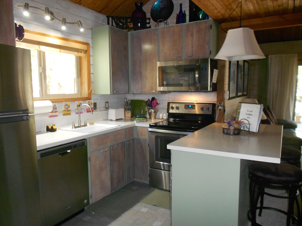 All new stainless steel appliances in a well-stocked kitchen.