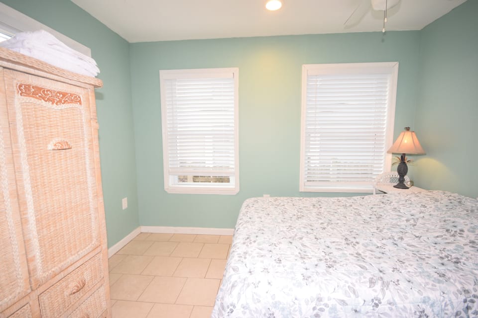 Bedroom 3 with full bed, tile floors, ceiling fan