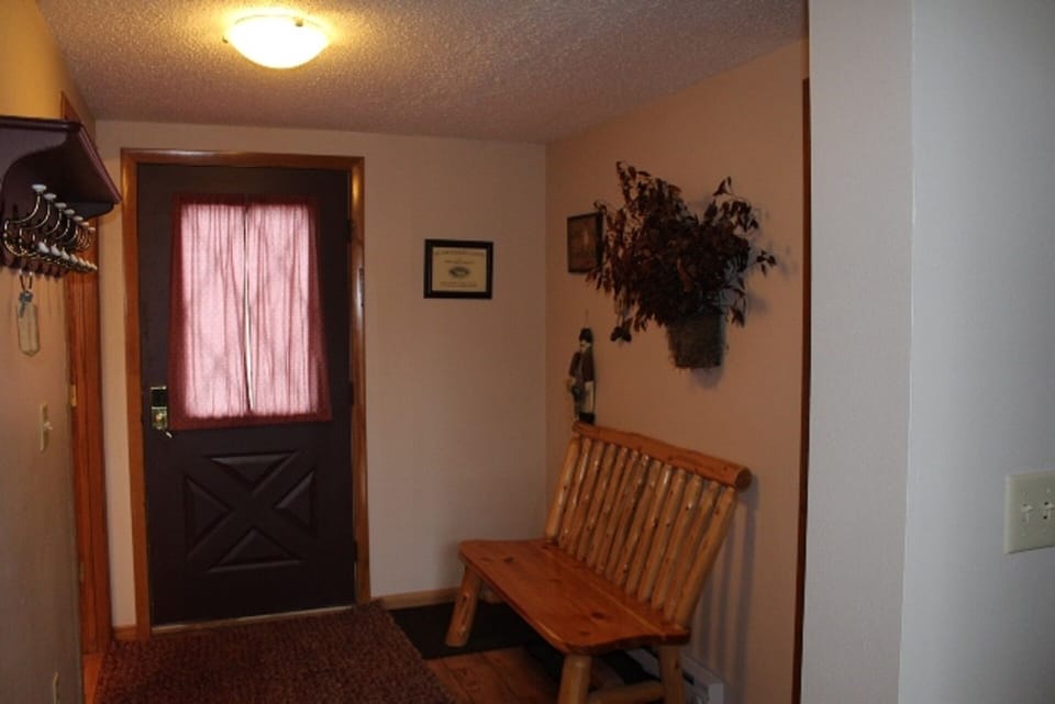 Entryway with a place for skis, hiking boots and all your gear!