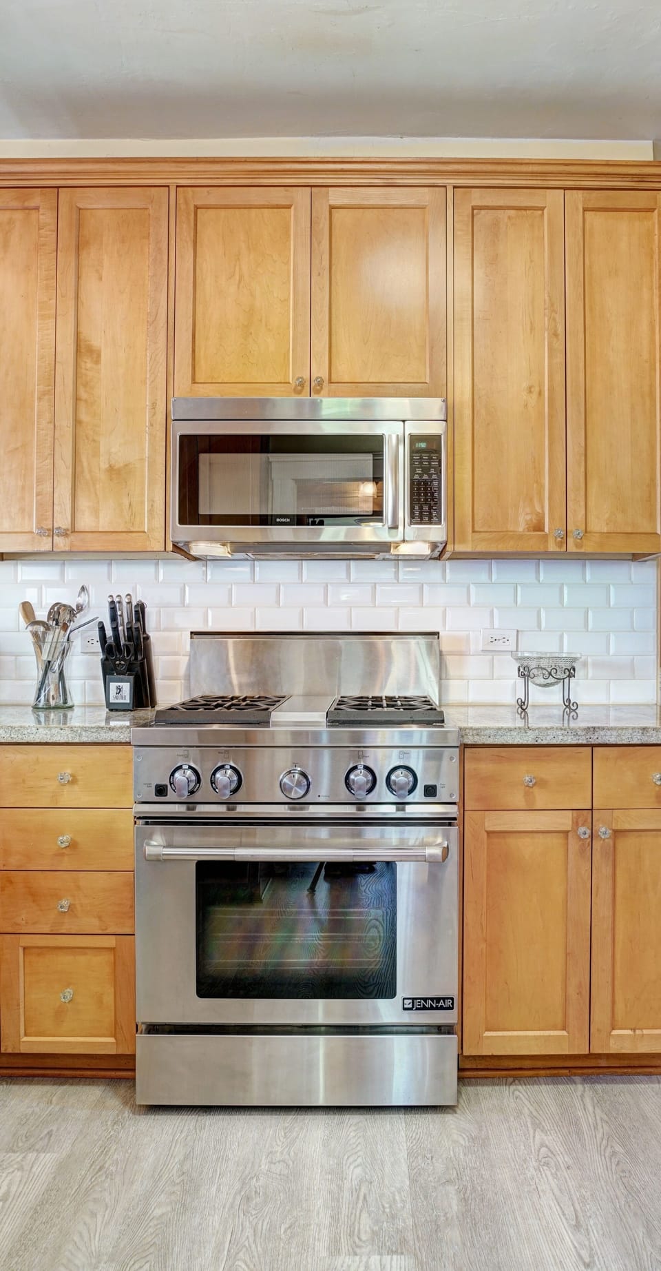 Gas stove, ample spices, pots and pans.